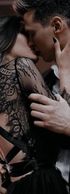 Romantic couple embracing in elegant evening attire during an intimate moment